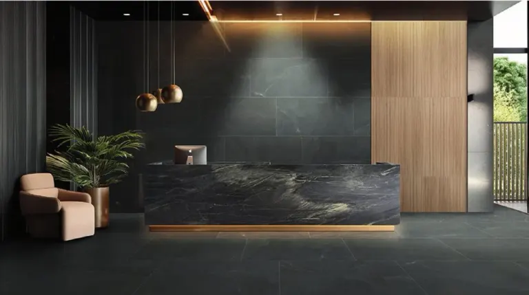 Reception desk in front of a dark tile wall with pendant lights