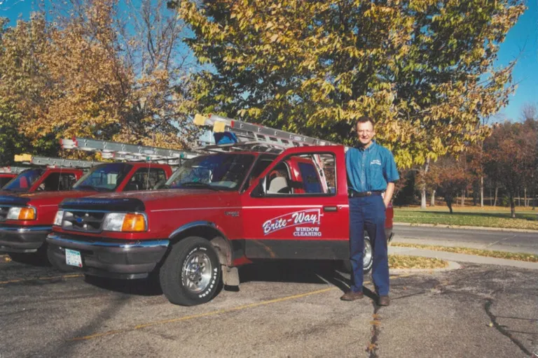 Duane Keller poses next to one of his Brite-Way cleaning trucks in October of 2000