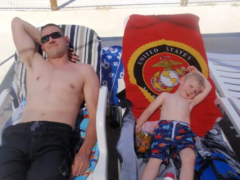 Jeremy relaxing with his son.