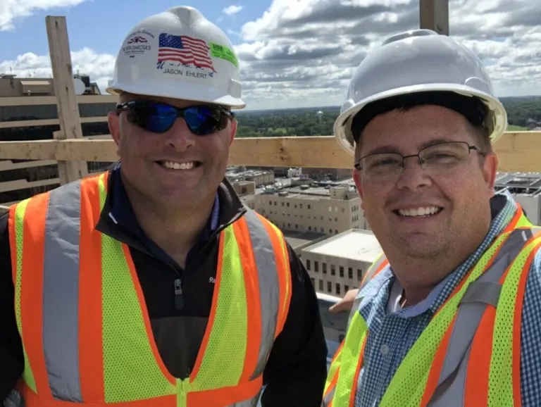 Matt stands with Jason Ehlert, President of the North Dakota Building Trades Union, on top of the Block 9 tower in downtown Fargo during its construction—definitely a place you don’t want to bring students.