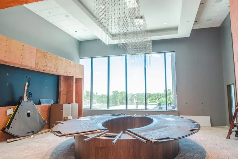 “This is our new boardroom,” Brantner said. “This table seats 20 people and there’s room for us to set up chairs around the outside. We have four 90-inch screens so people can see from all sides what is going on.”