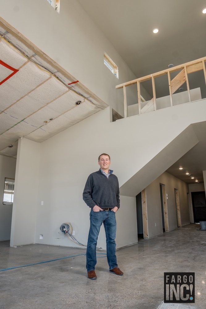 Nick Horob stands in the middle of the construction of their new office in West Fargo.