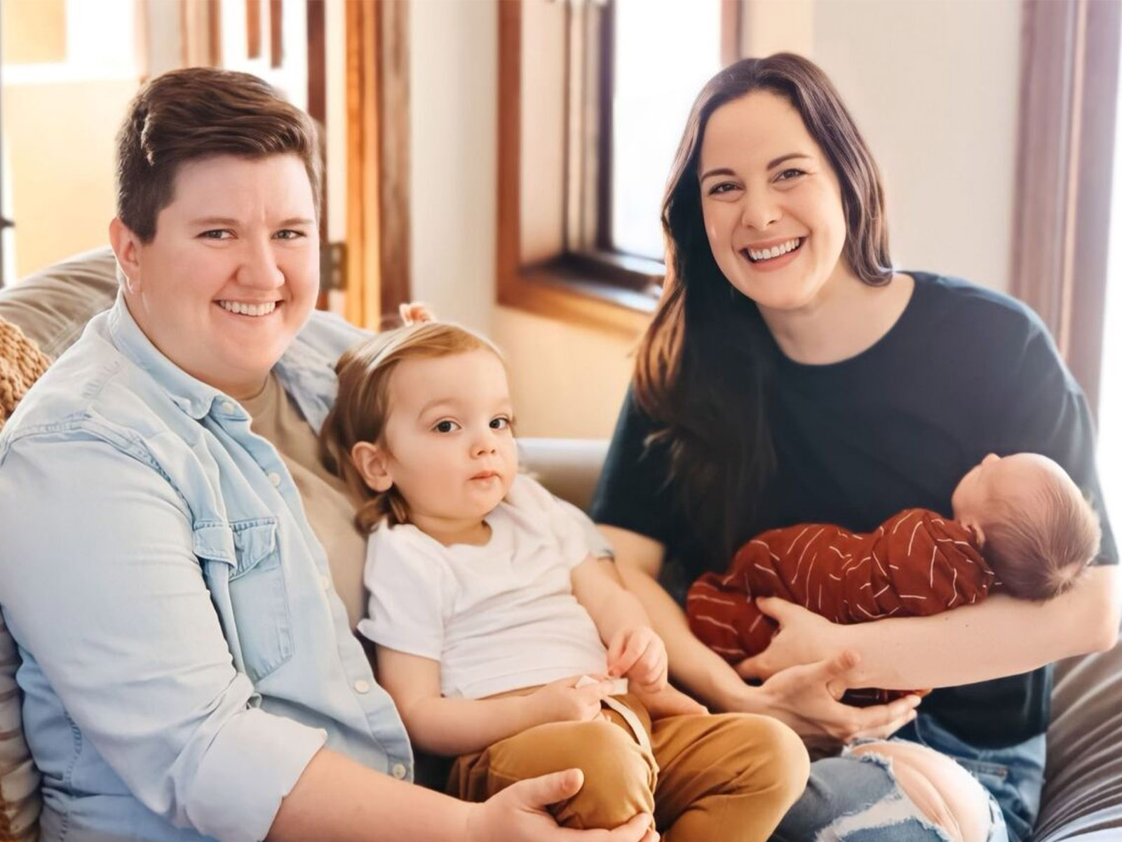 Molly Swanston (left) with her wife Alexa and their two children.